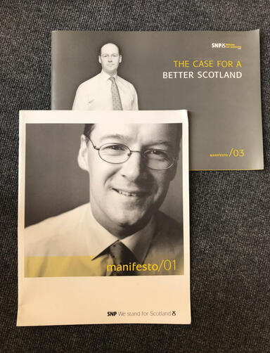 Photo of two SNP election manifestos dating from 2001 and 2003 with John Swinney on the front cover.